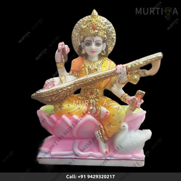 Marble Saraswati Maa With Light Orange Saree On Lotus - 12 Inch Marble Saraswati Maa With Light Orange Saree On Lotus - 12 Inch